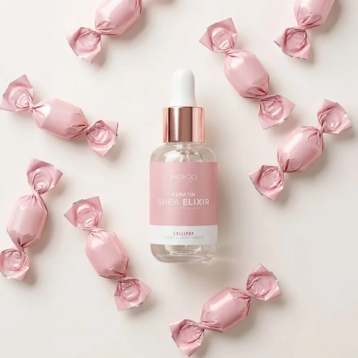Keratin Shea Elixir Lollipop 8ml Indigo – flat lay bonbons roses