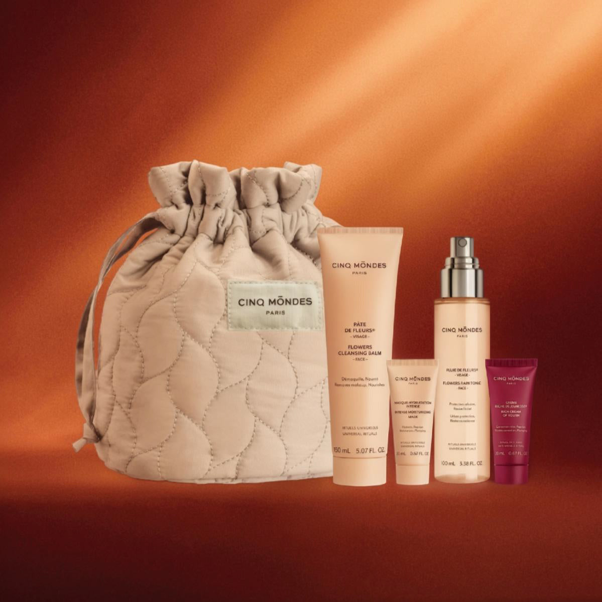 joli pochon cinq mondes avec cosmetiques incluant pate de fleurs pluie de fleurs creme riche et masque
